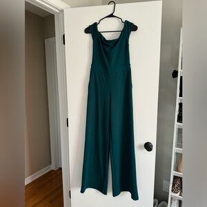 Express emerald green off the shoulder wide leg jumpsuit. Size XS.